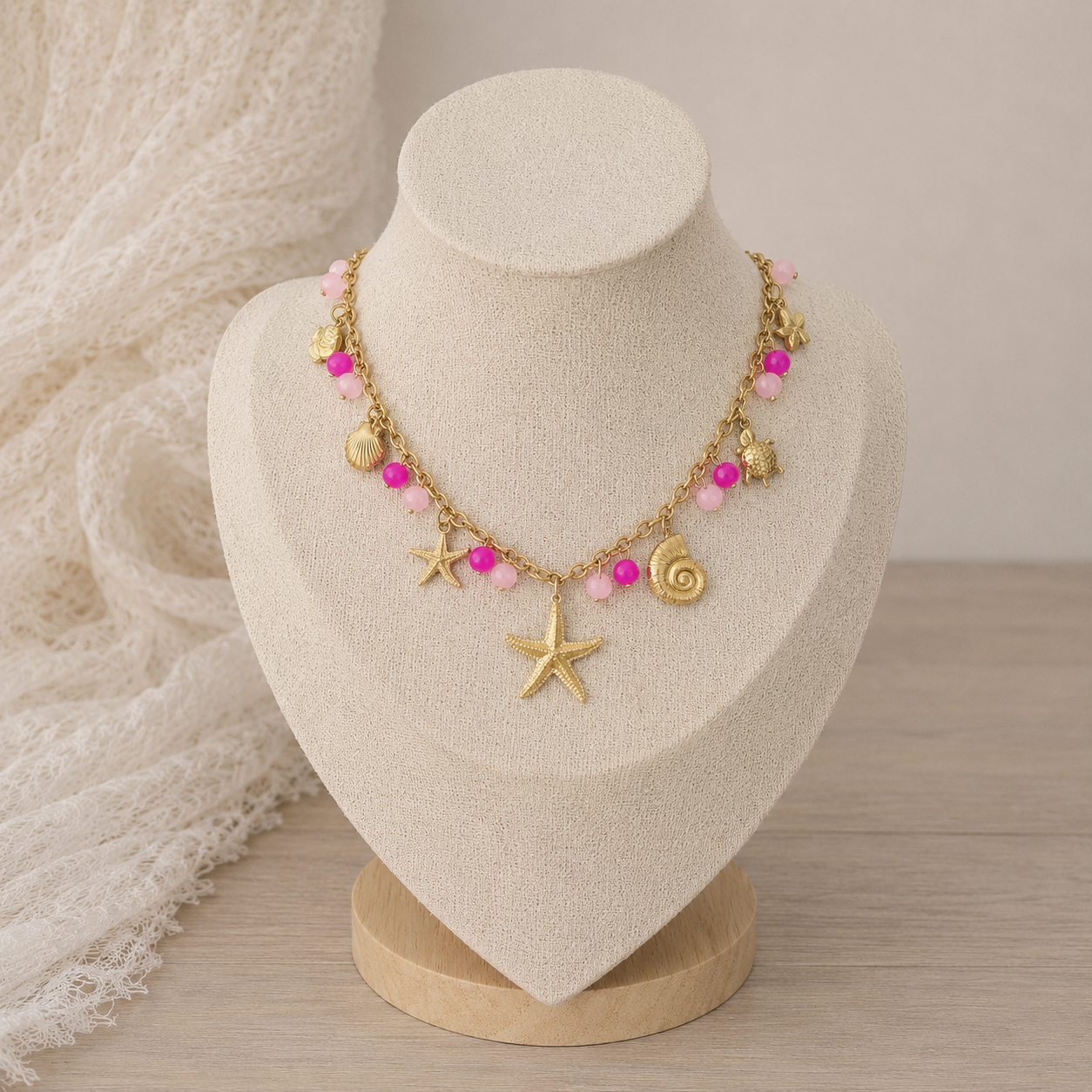 Collier breloques roses et étoile de mer